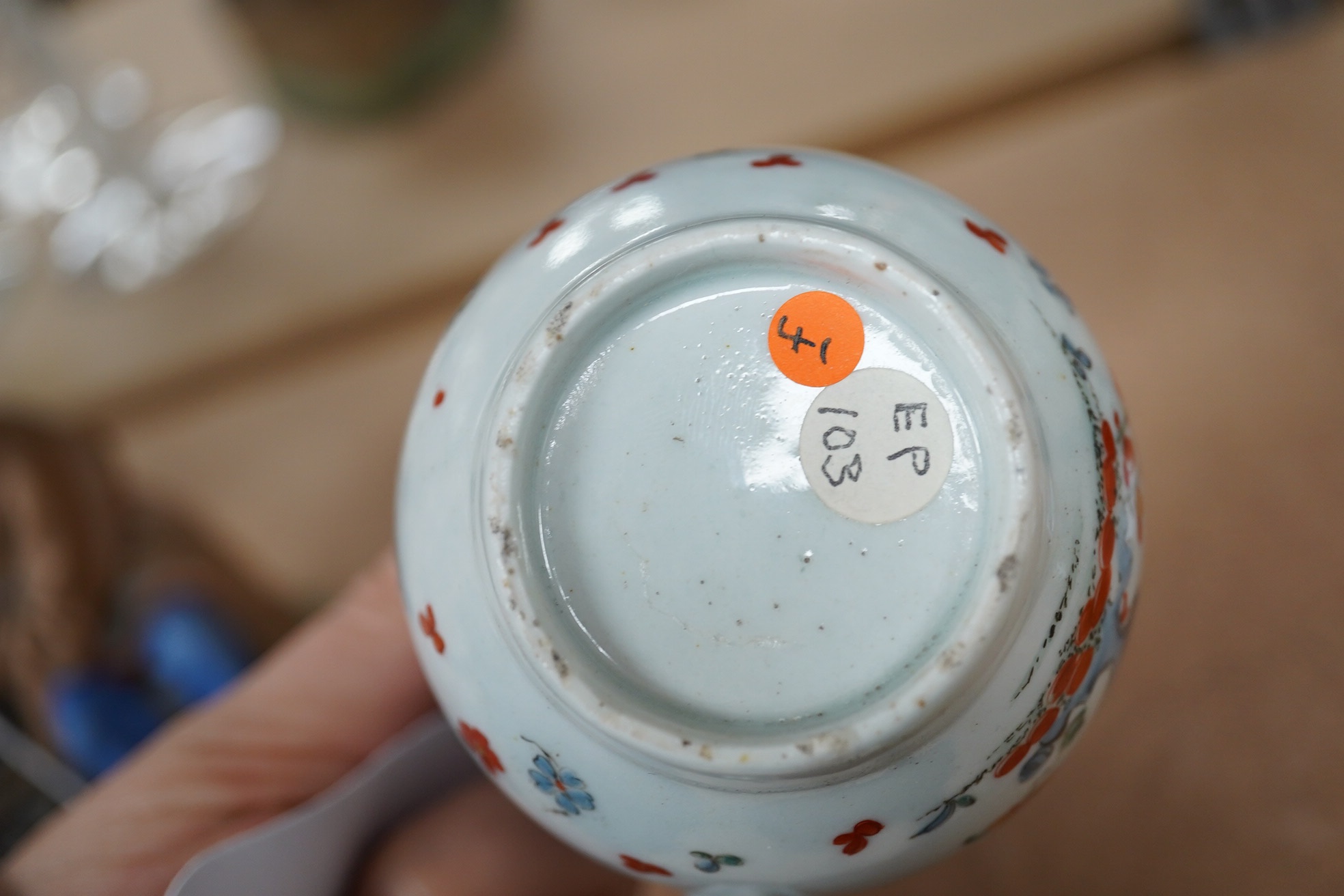 An 18th century Worcester polychrome porcelain mug decorated with quails, 9cm high. Condition - fair, chip to top rim